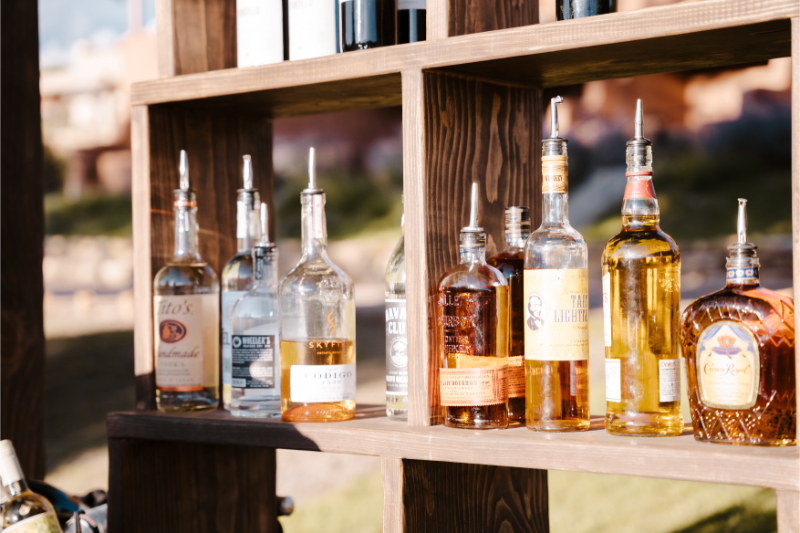 Bourbon bottles displayed at wedding. 