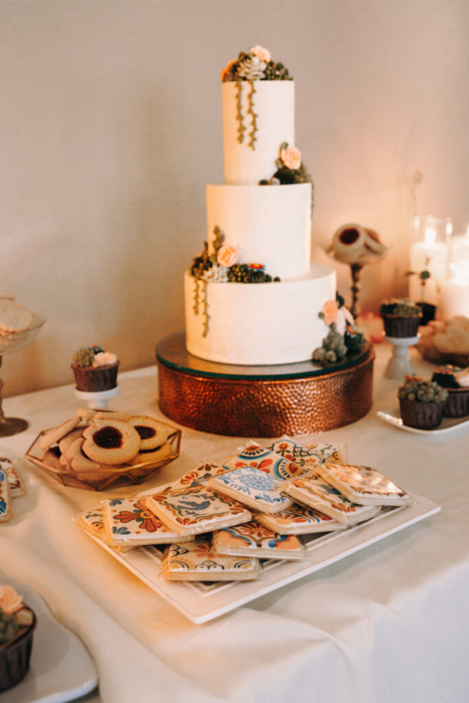 Wedding cake with New Mexico tile cookies. 