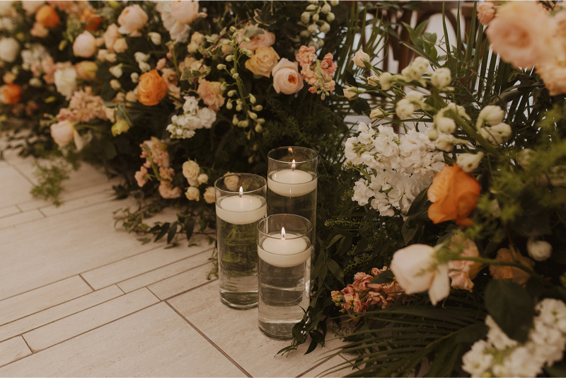 Floral and candle wedding ceremony aisle decor