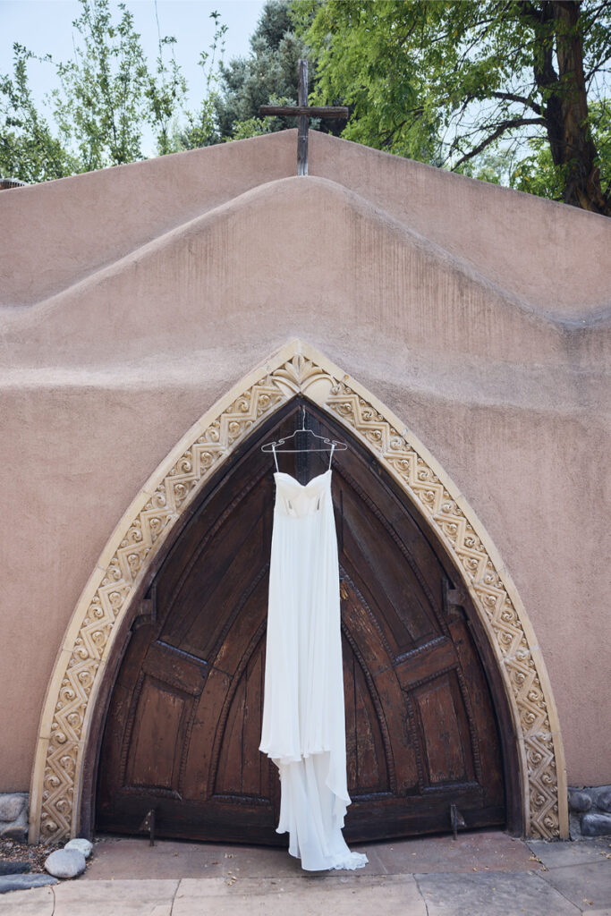 wedding dress hanging from wedding venue in Santa Fe