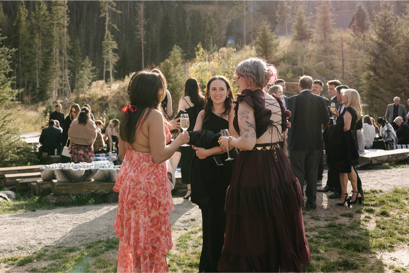 Guests in black and maroon wedding dress codes.
