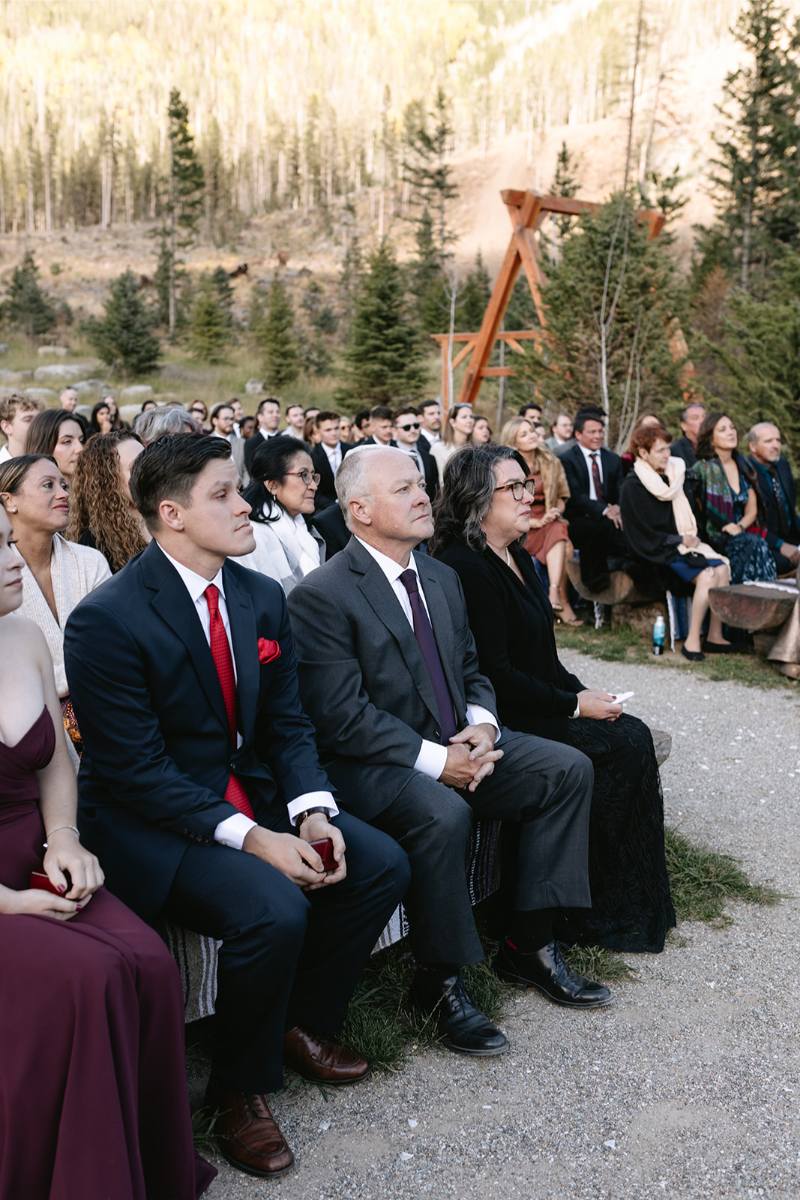 Guest wearing cohesive outfits to match the wedding dress codes of the event.