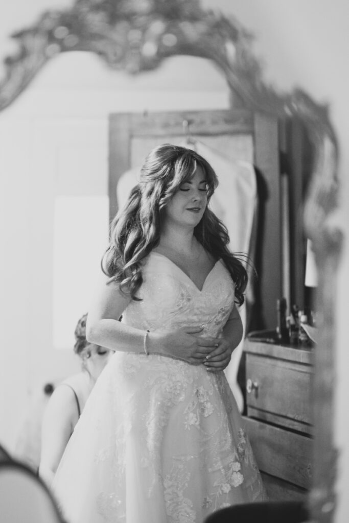 Bride takes a moment to breathe before the wedding day order of events takes place.