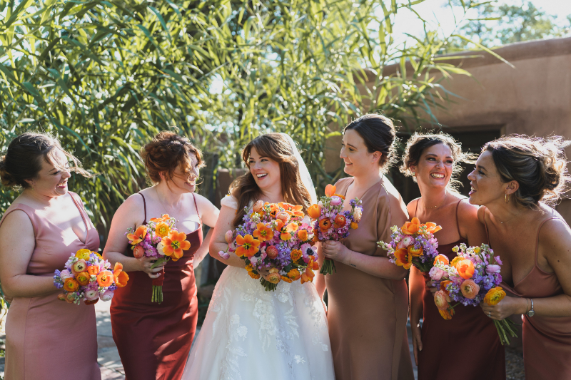 Bridal party posing together for portrait.