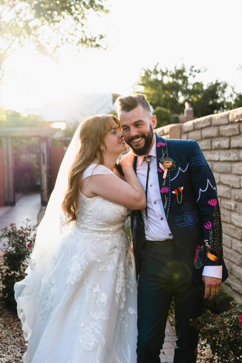 Bride and groom smiling, their wedding day order of events running smoothly.