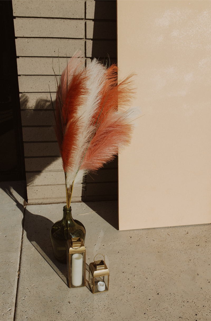 Pampas grass ceremony decor for fall wedding in New Mexico.