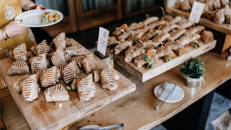 Follow these wedding rehearsal dinner ideas for sharing local cuisine all your guests will love.