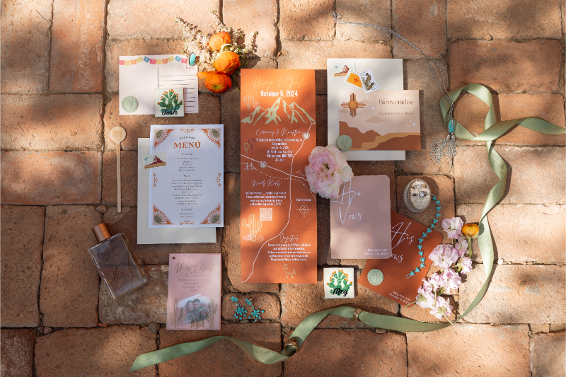 Stationary flat lay of wedding weekend itinerary for celebration in Albuquerque. 