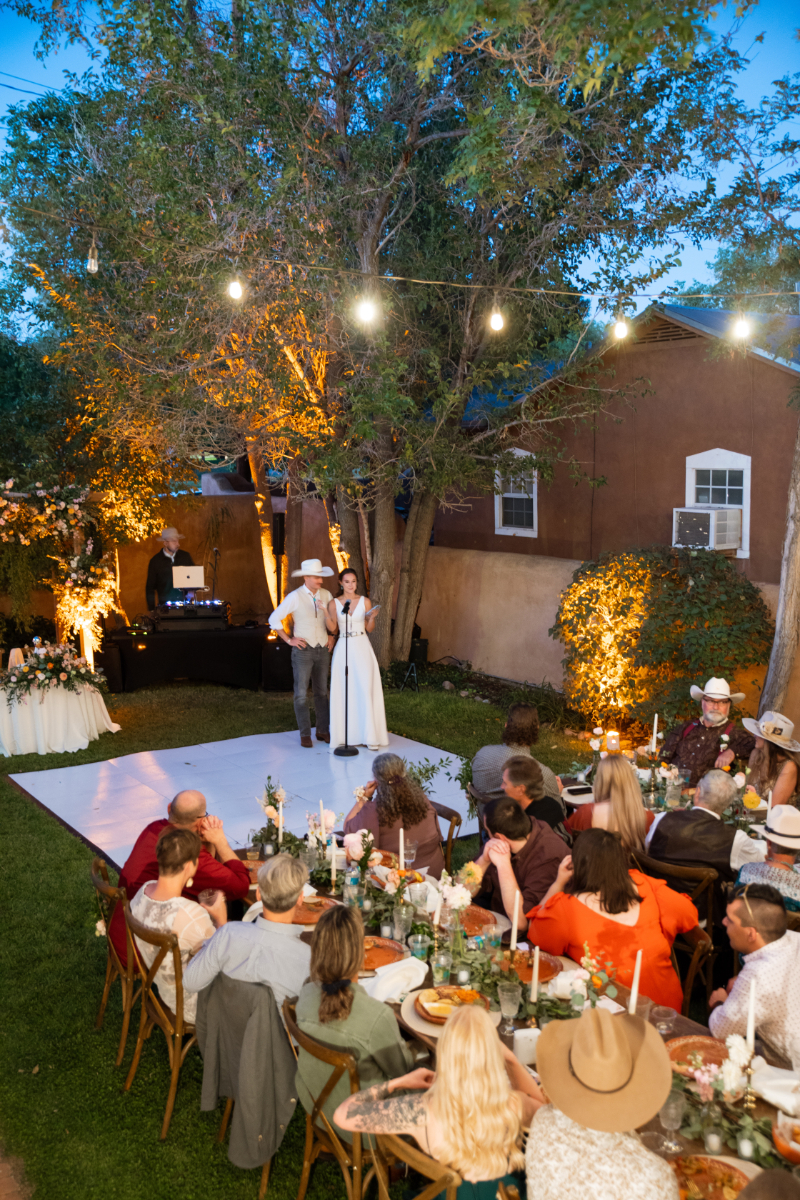 Bride and groom gives speech during welcome party, one of the events on their wedding weekend itinerary.
