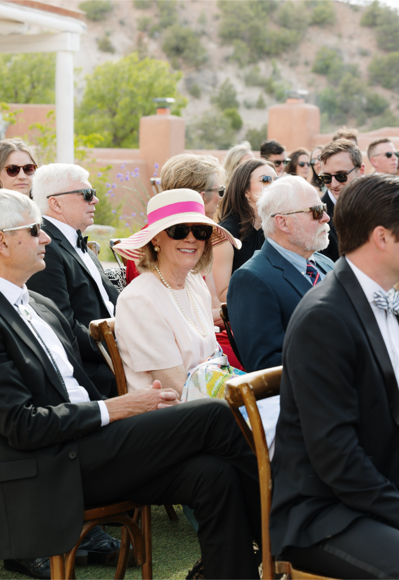 Guests wait patiently for bride to enter wedding ceremony.