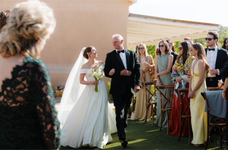Father walks bride down the aisle during unplugged ceremony.