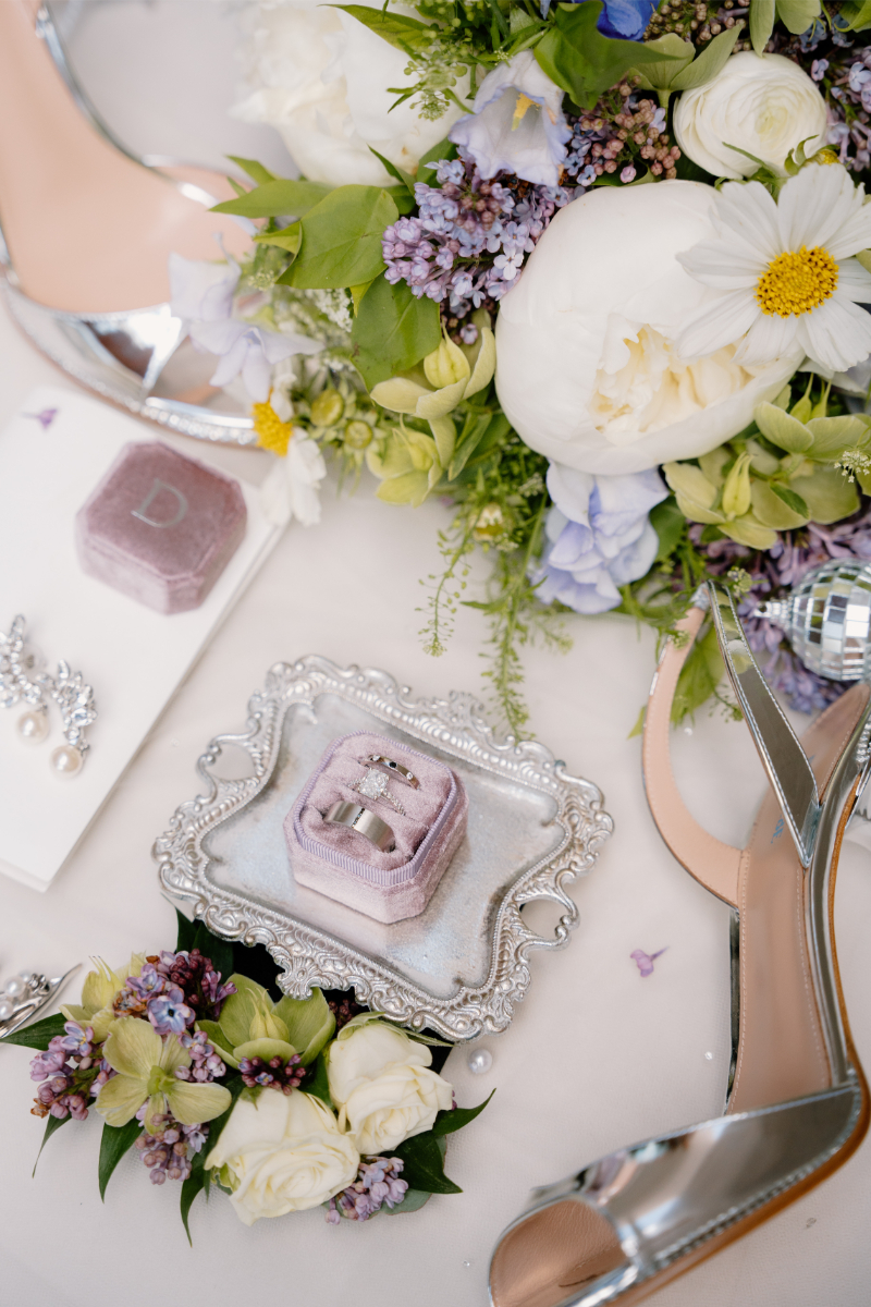 Flatlay of items used in colorful wedding themes.