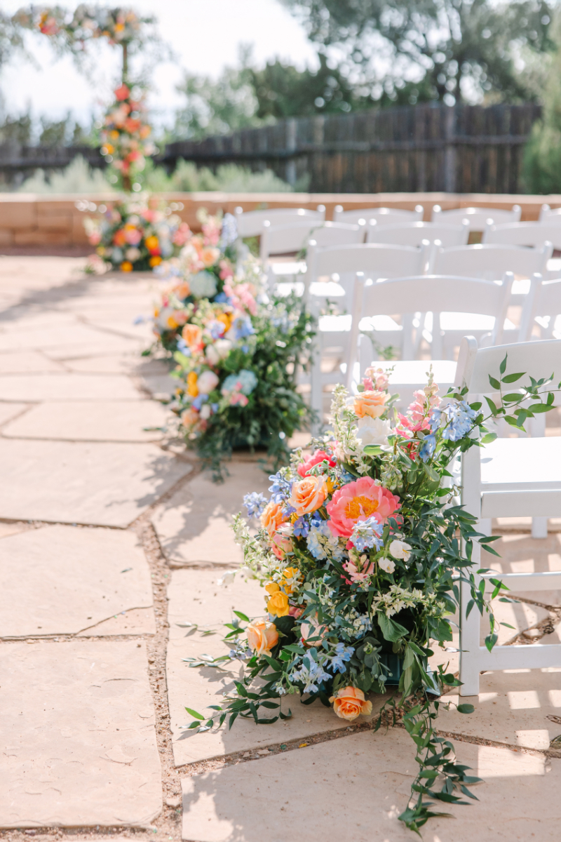 Ceremony aisle floral arrangments.