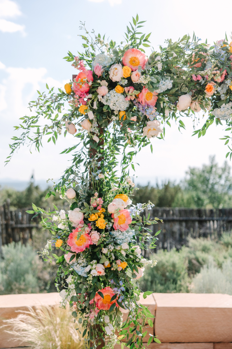 Close up of floral arrangement on ceremony arch, designed by one of the best Albuquerque florists.