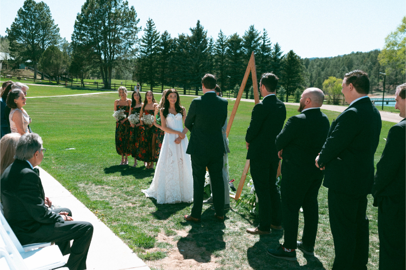Bride and groom exchange vows during wedding ceremony at Inn of Mountain Gods.