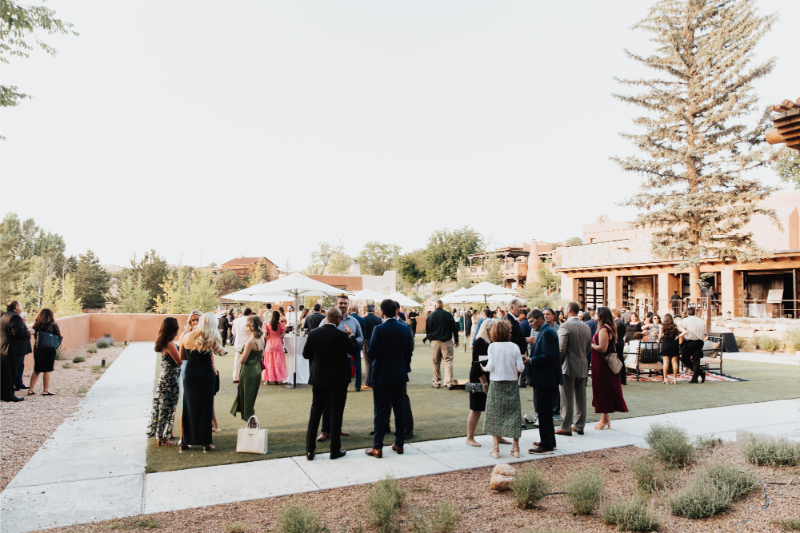 Guests mingle during cocktail hour at Bishop's Lodge.