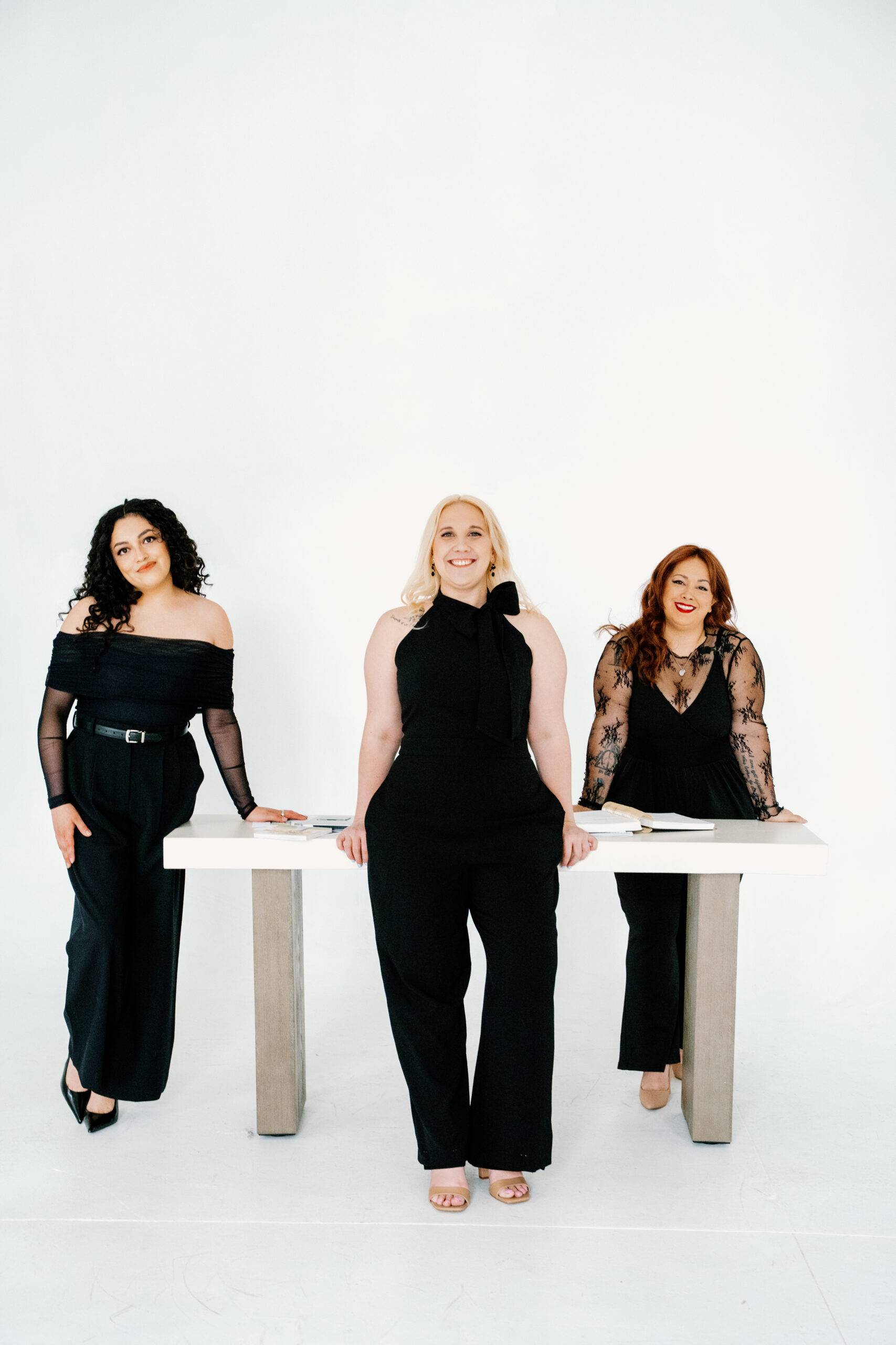 Verdeaux & Co. team pose for photo against white background.