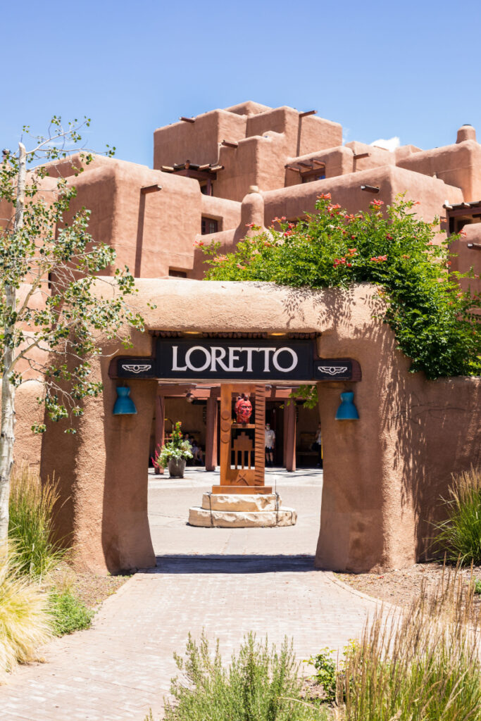Entrance archway to Inn and Spa at Loretto, with sign over archway that says "Loretto"