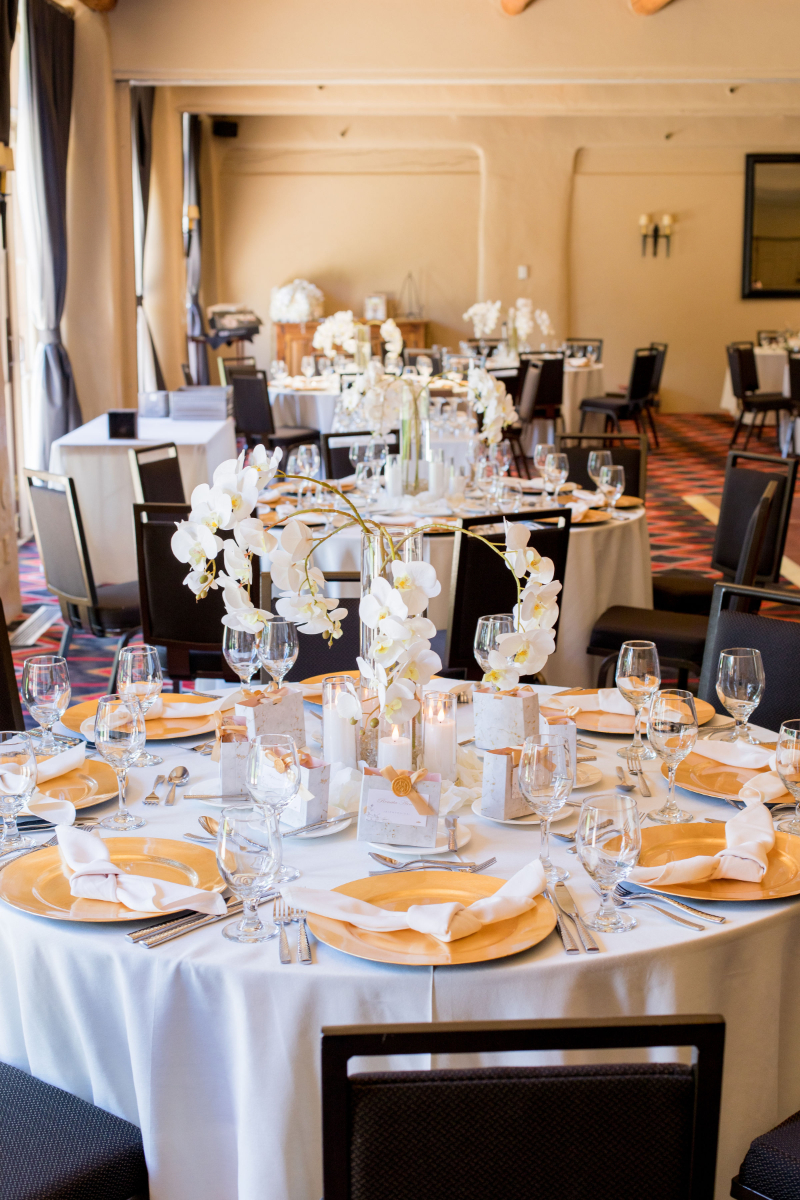 White floral centerpiece for wedding reception.