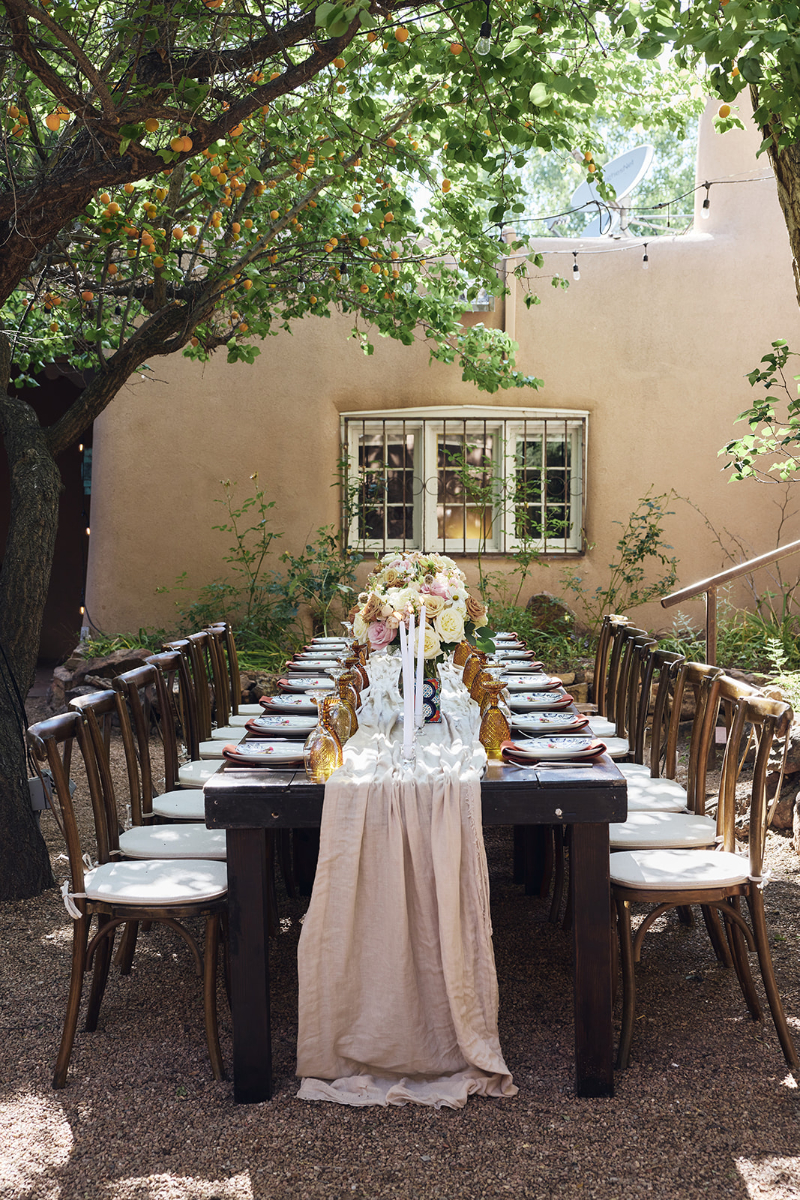 Table setting placed for backyard wedding reception.