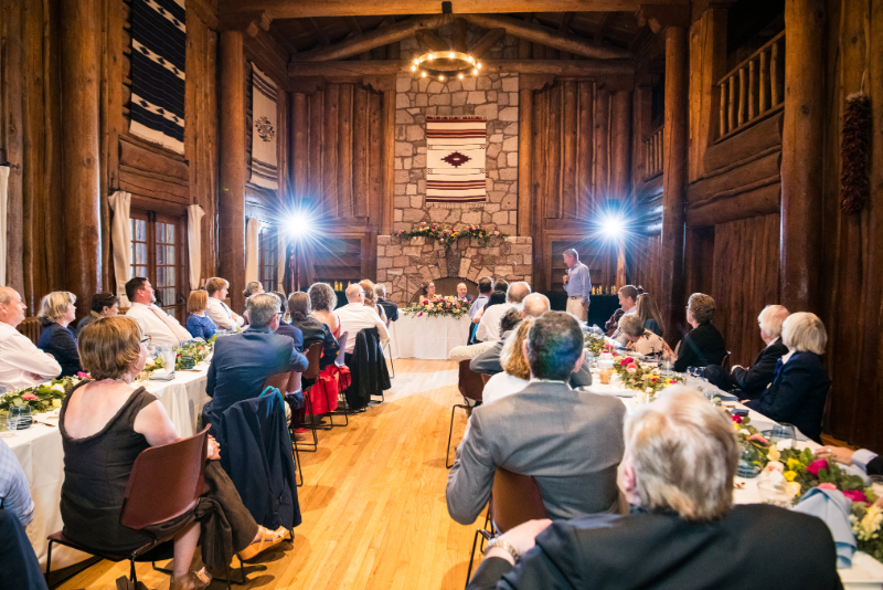 Guest gives speech during wedding reception.