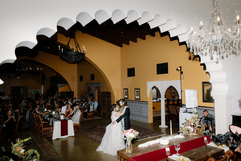Bride and groom share their first dance in their mansion wedding venues.