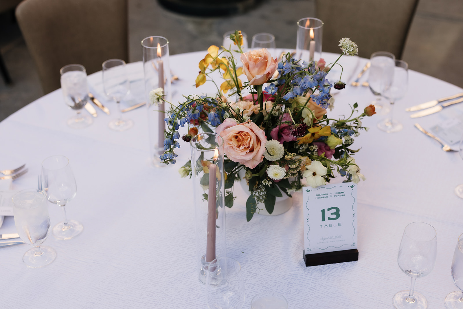 Floral centerpiece on reception table, perfect inspiration for a wedding vision board.