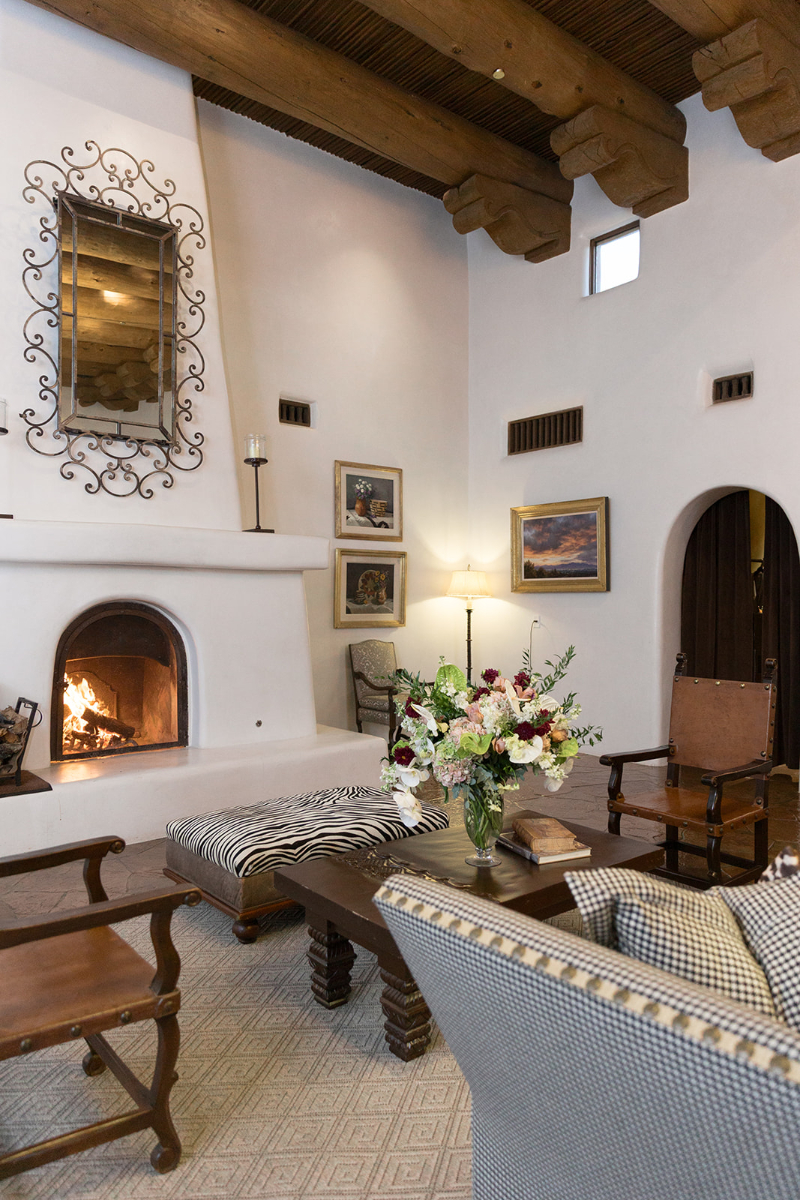 Lounge area for Santa Fe weddings with adobe fireplace.