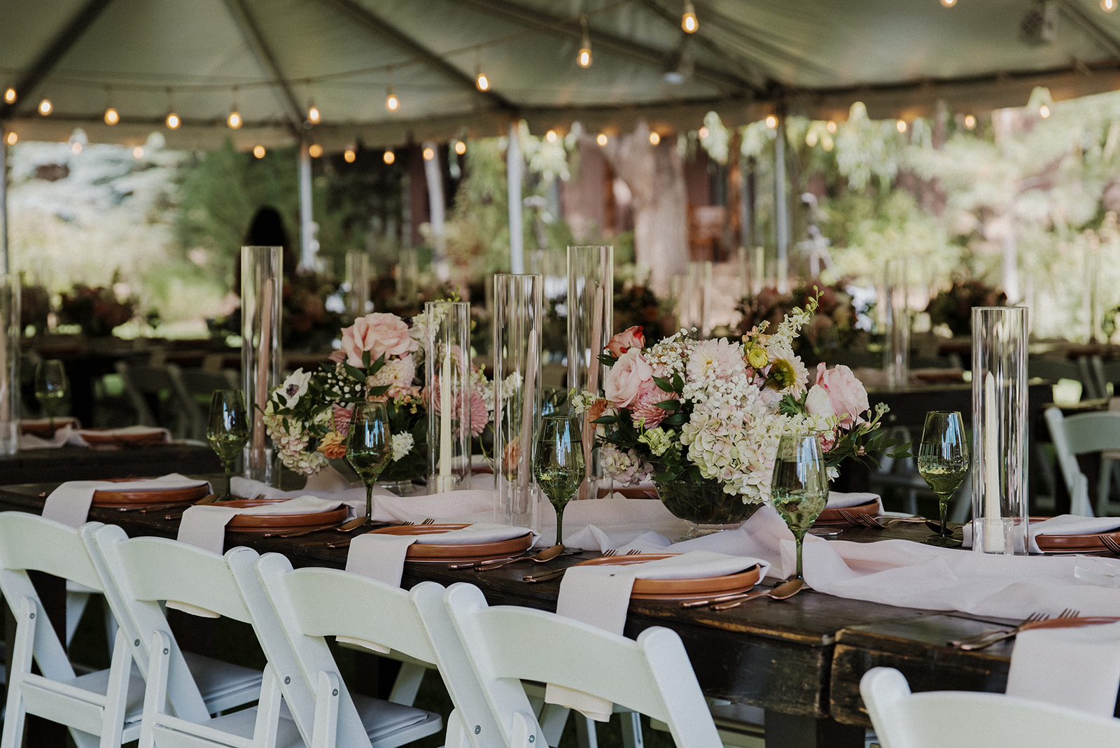 Wedding tablescape decorated for tented reception.