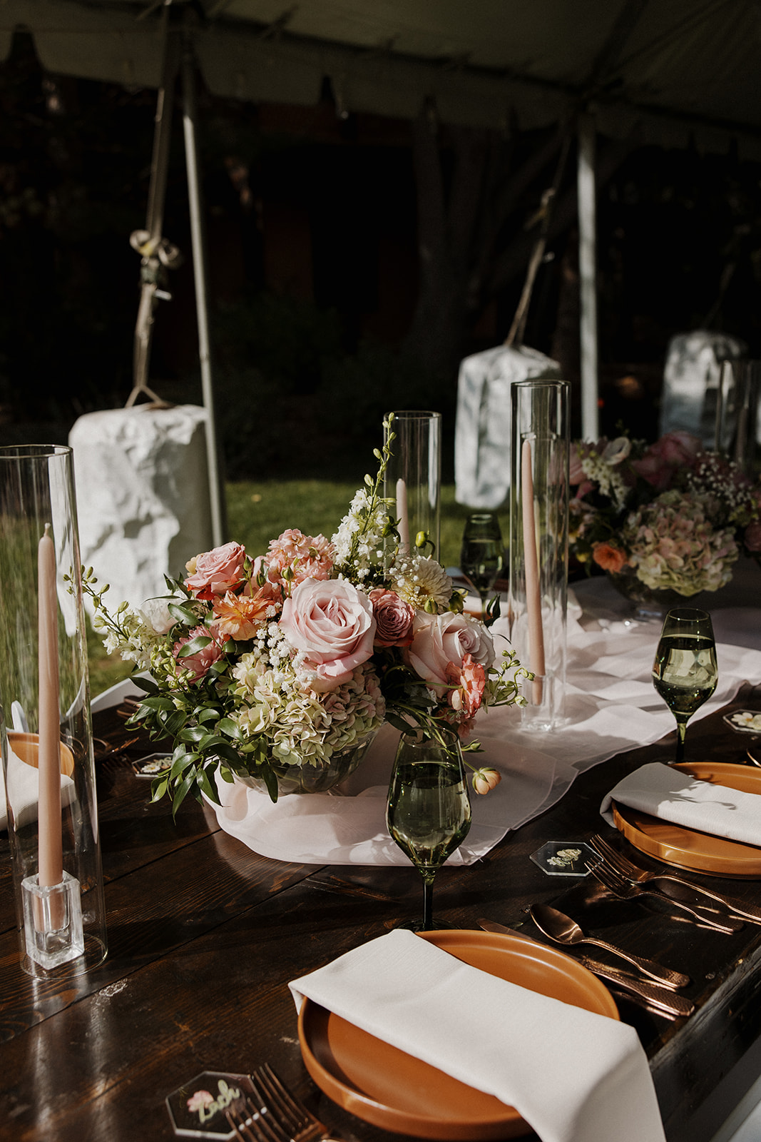 Reception tablescape decorated with shades of green and pink details for a Tennessee mountain wedding.