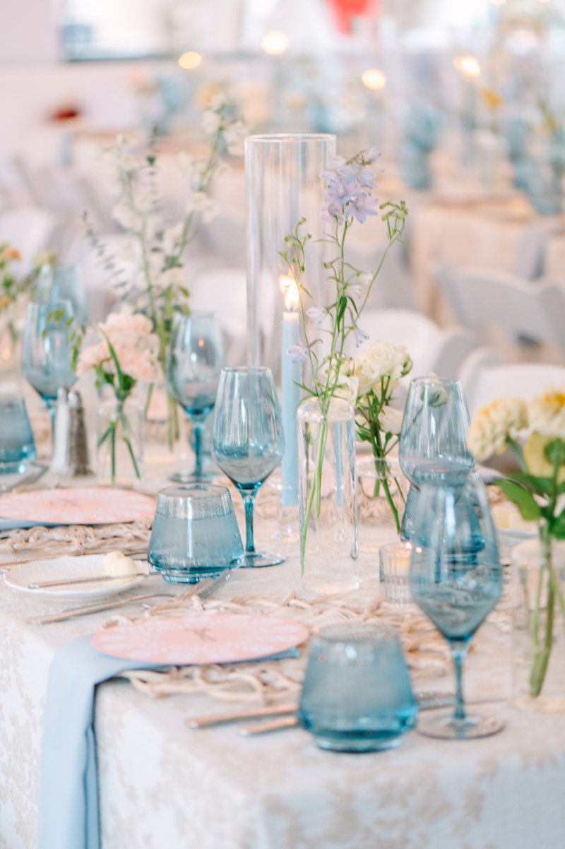 Tablescape details with greenery and blue details.