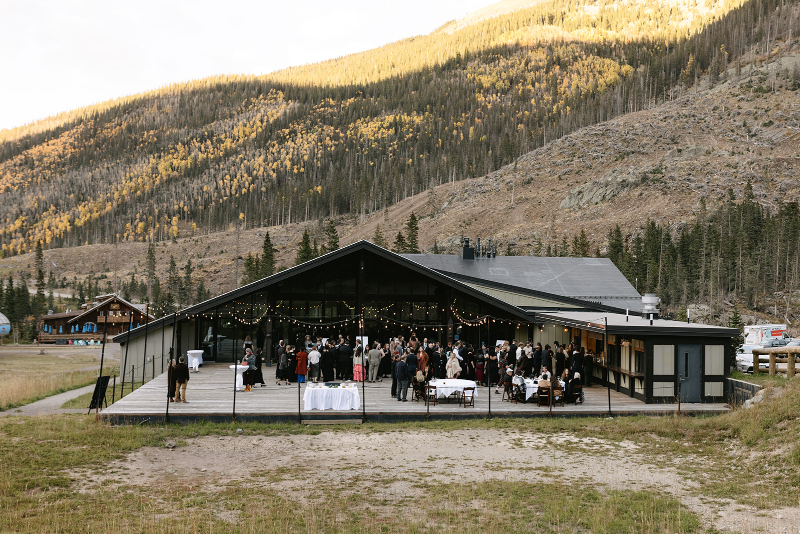 Guests celebrate cocktail hour on the patio at this wedding in Knoxville.