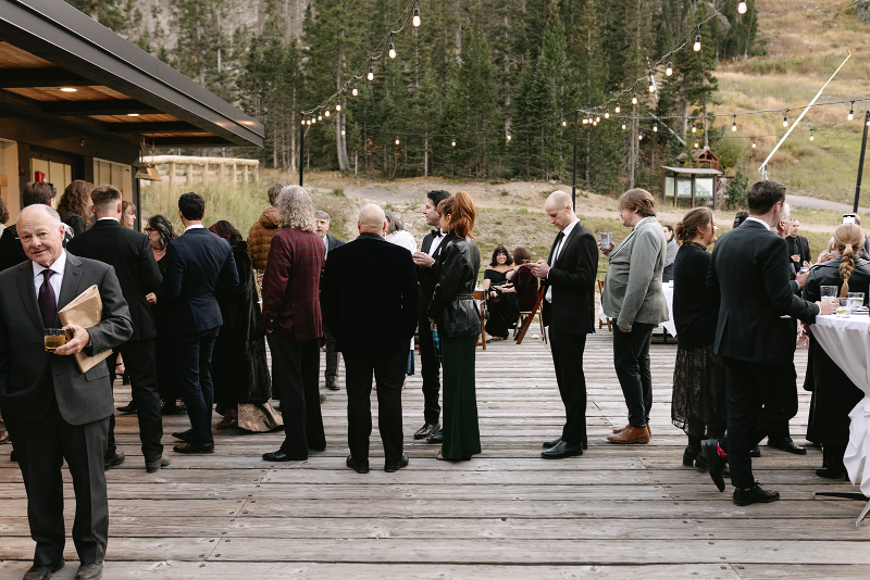Guests mingle on patio of this Knoxville wedding cocktail hour.