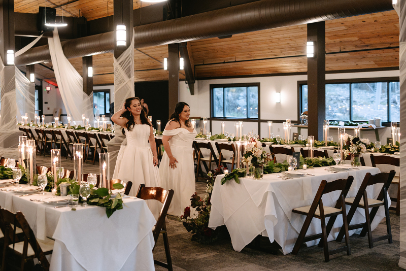 Brides walk into reception space for reveal of the design.