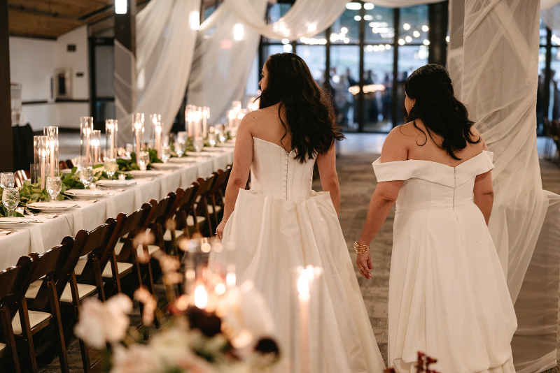 Brides walk into reception space for reveal of the design.