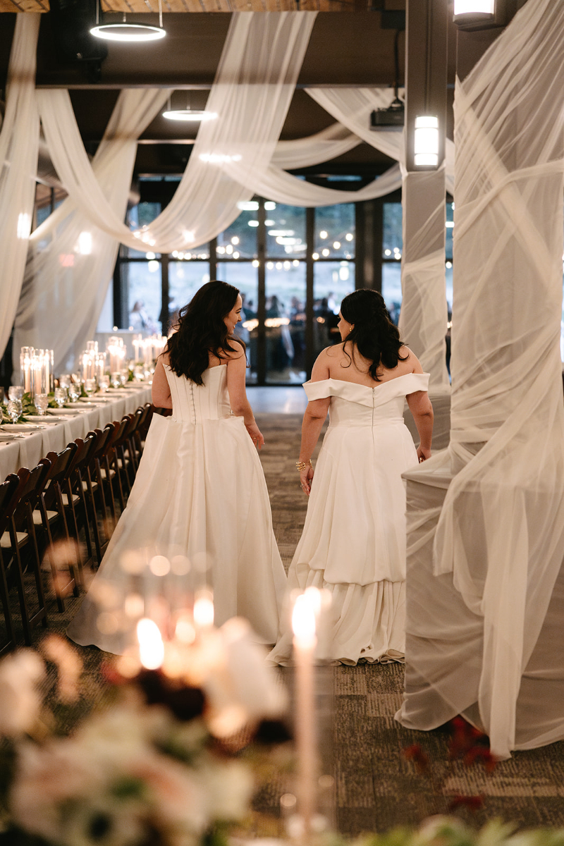 Brides walk into reception space for reveal of the design.