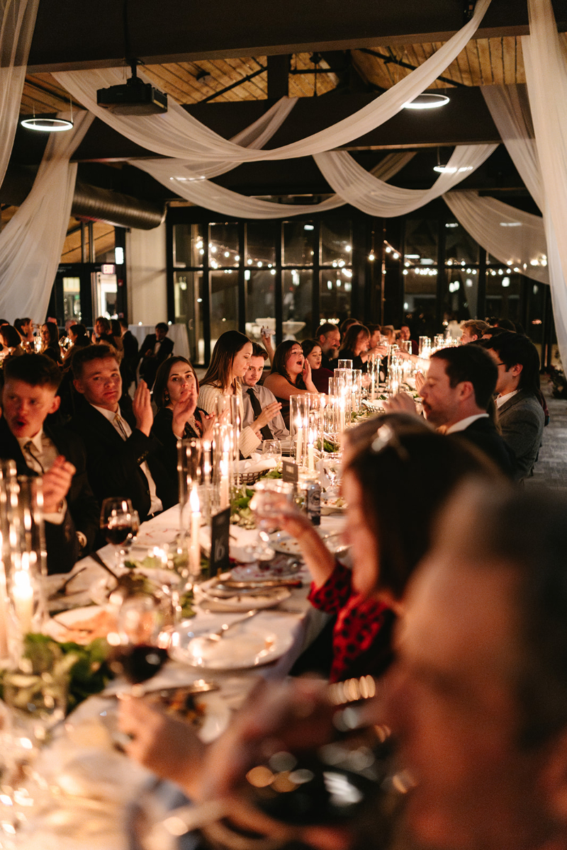Wedding guests sit at reception table at this venue in Knoxville.
