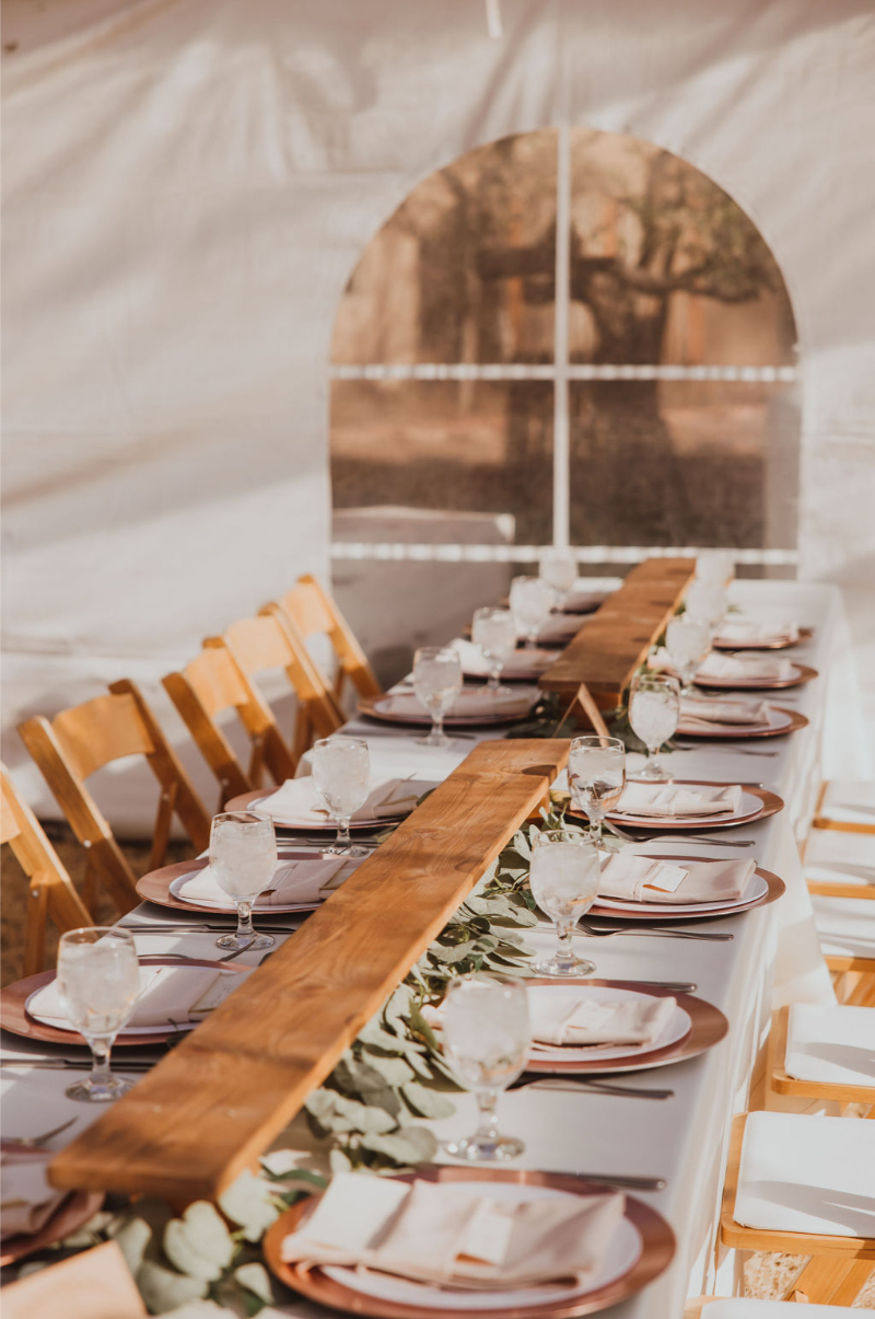 Long tables decorated for spring wedding reception.