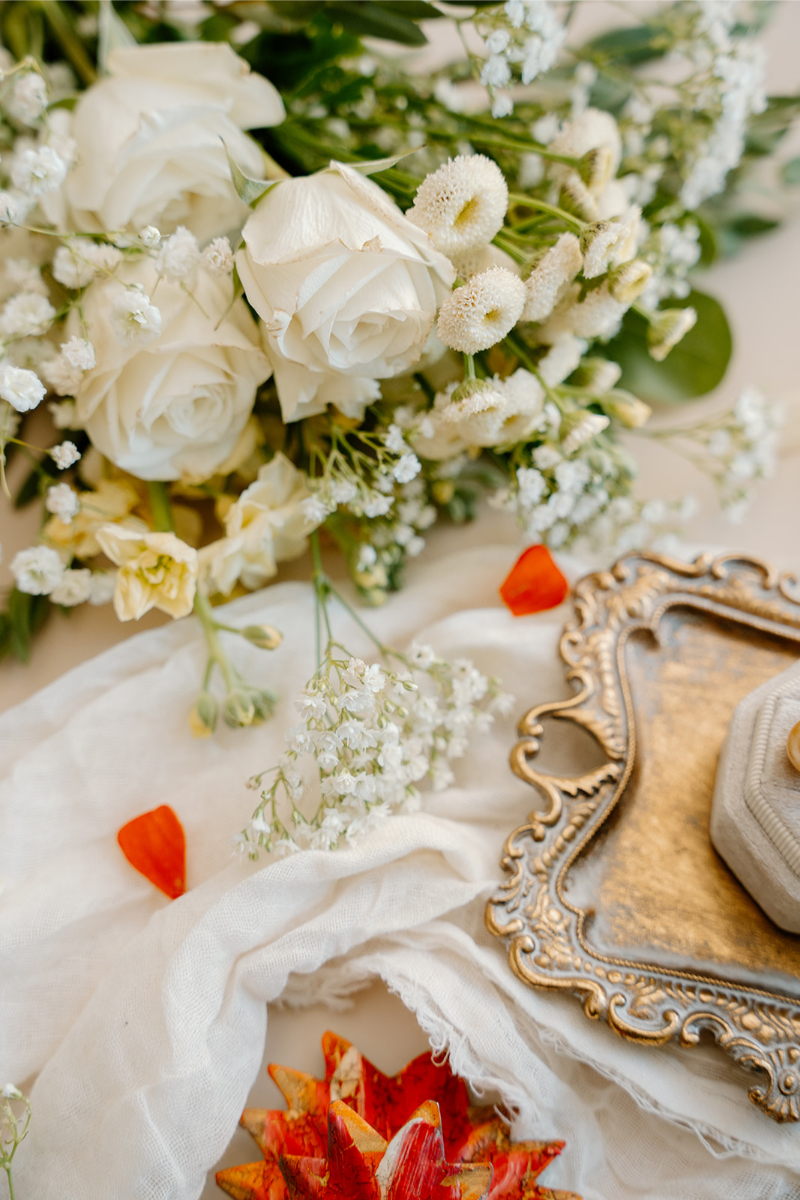 Detail shot of wedding day details including bouquet, trays.
