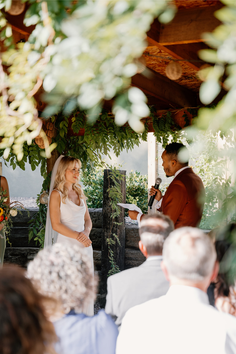 Bride and groom exchange the vows they wrote they wrote for one another during their desert wedding weekend in New Mexico.