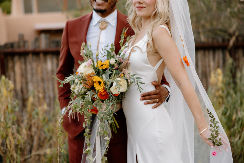 Bride and groom take portraits after their ceremony.