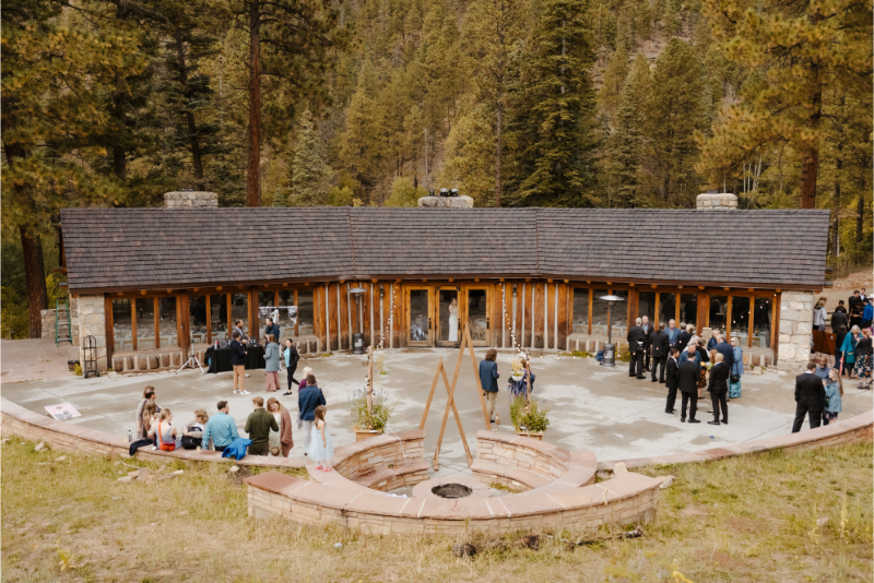 Outdoor wedding venues in New Mexico featuring guests mingling for cocktail hour on the patio.
