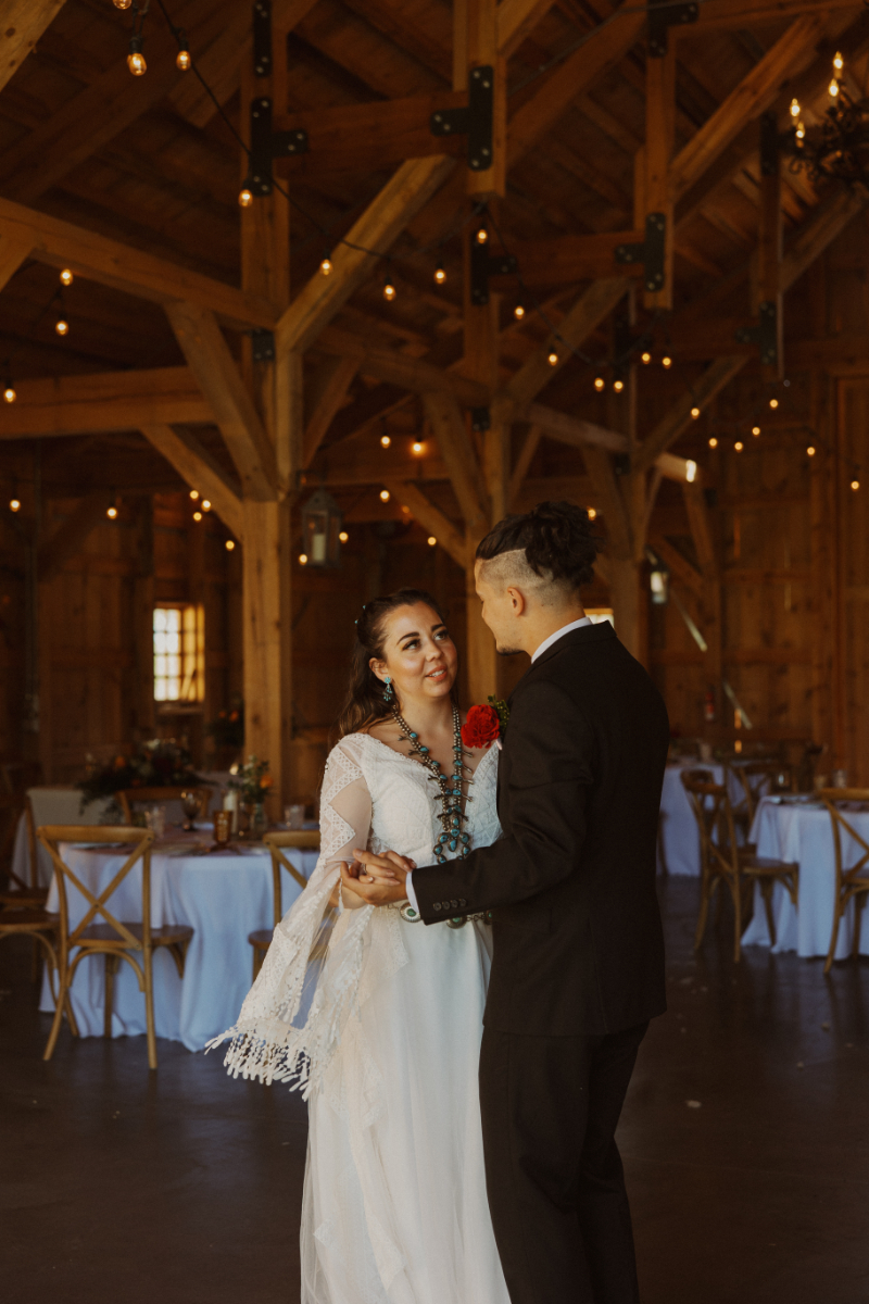 Bride and groom share first dance during reception.