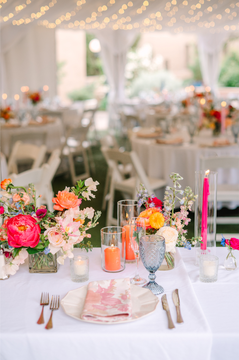Colorful spring stems used in a clear glass bud vase centerpieces for a New Mexico wedding.