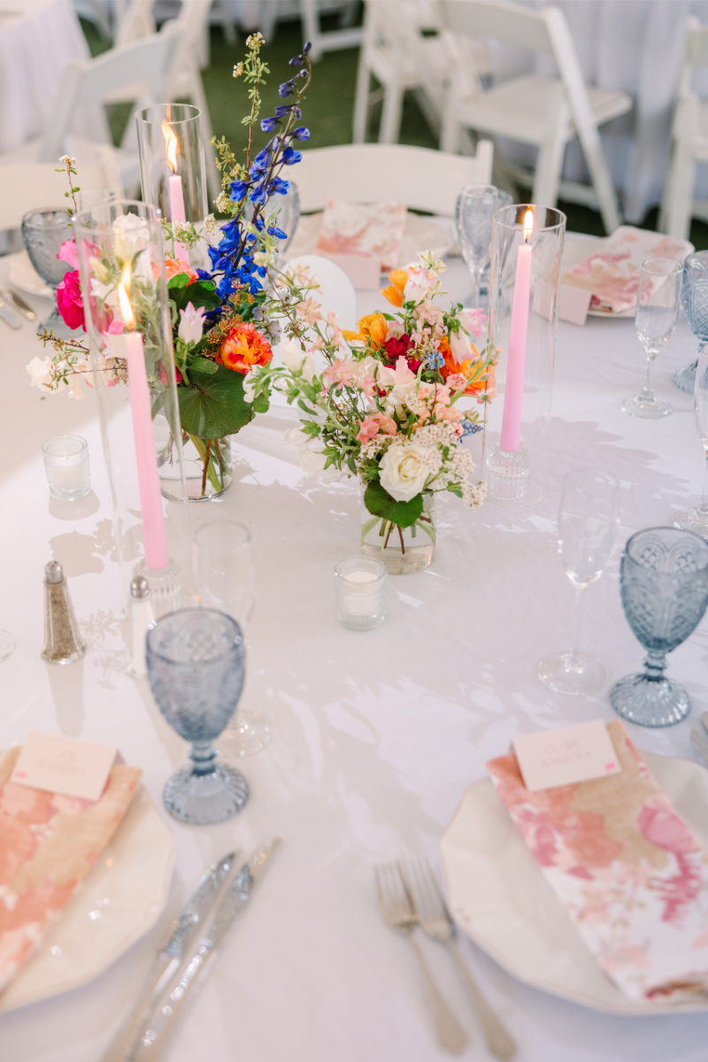 Colorful spring stems used in a clear glass bud vase centerpieces for a New Mexico wedding.