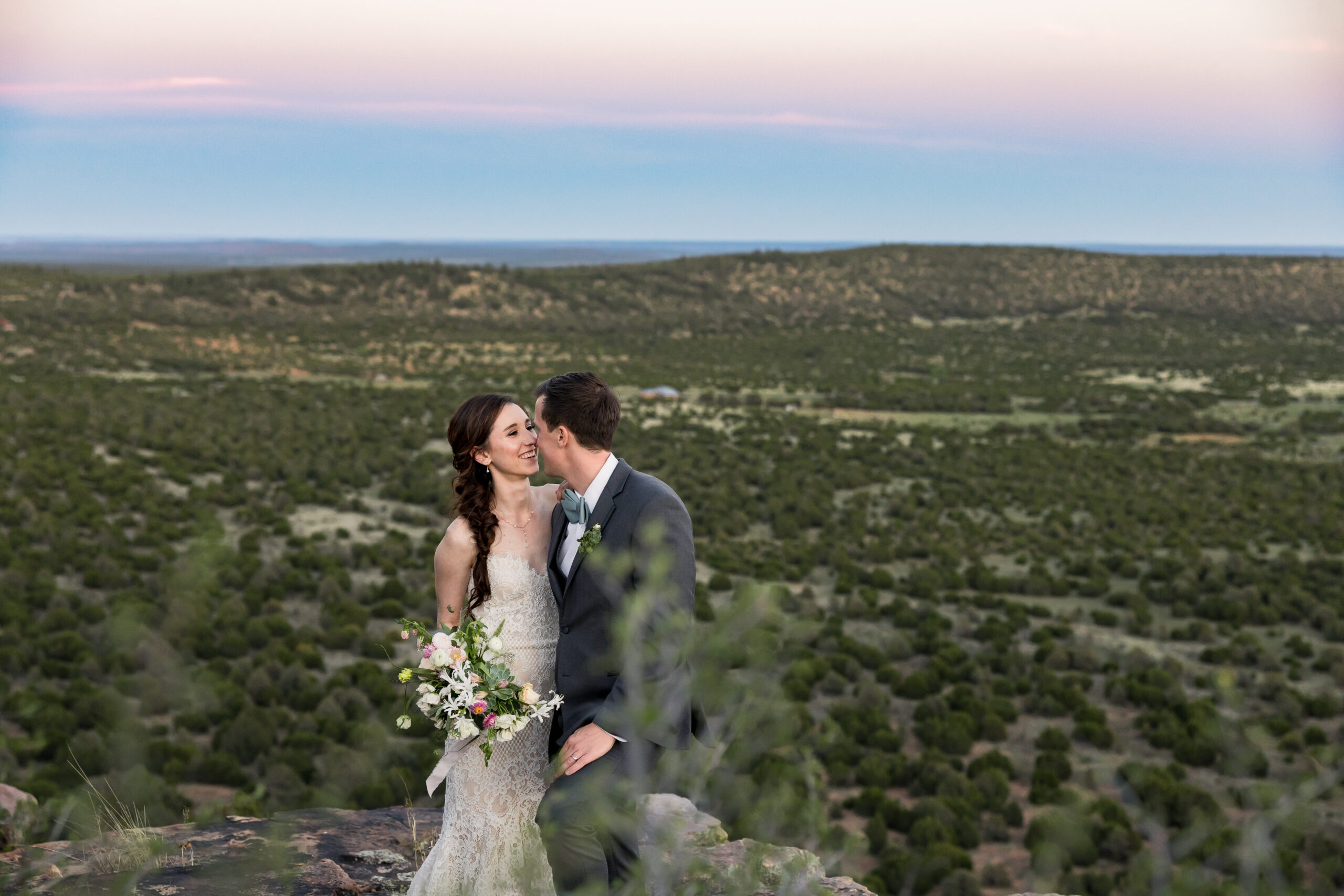 Bride and groom take sunset portraits during their Tennessee wedding overlooking the rolling hills.