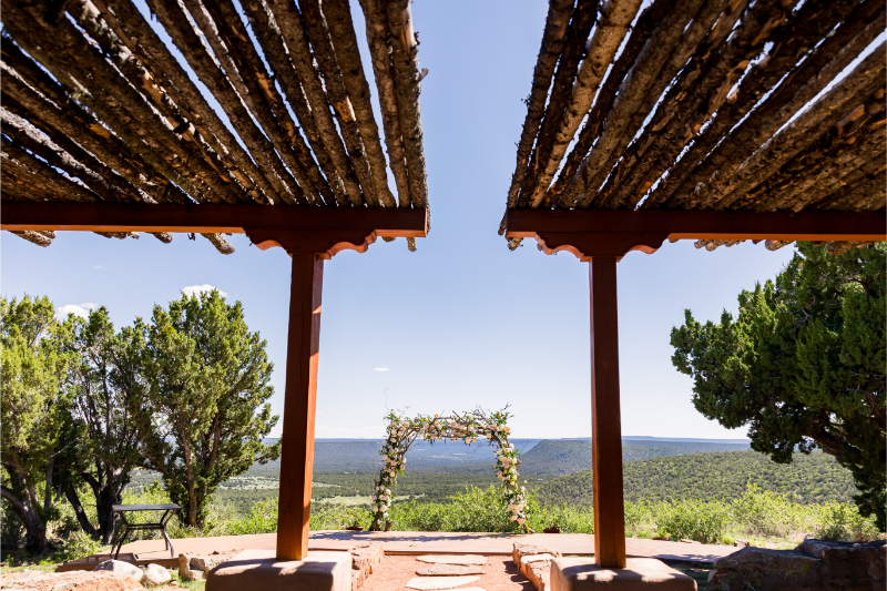 View of ceremony altar from guest seating for an outdoor Tennessee wedding ceremony overlooking rolling hills.