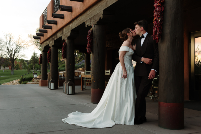 Bride and groom kiss before their New Mexico wedding.