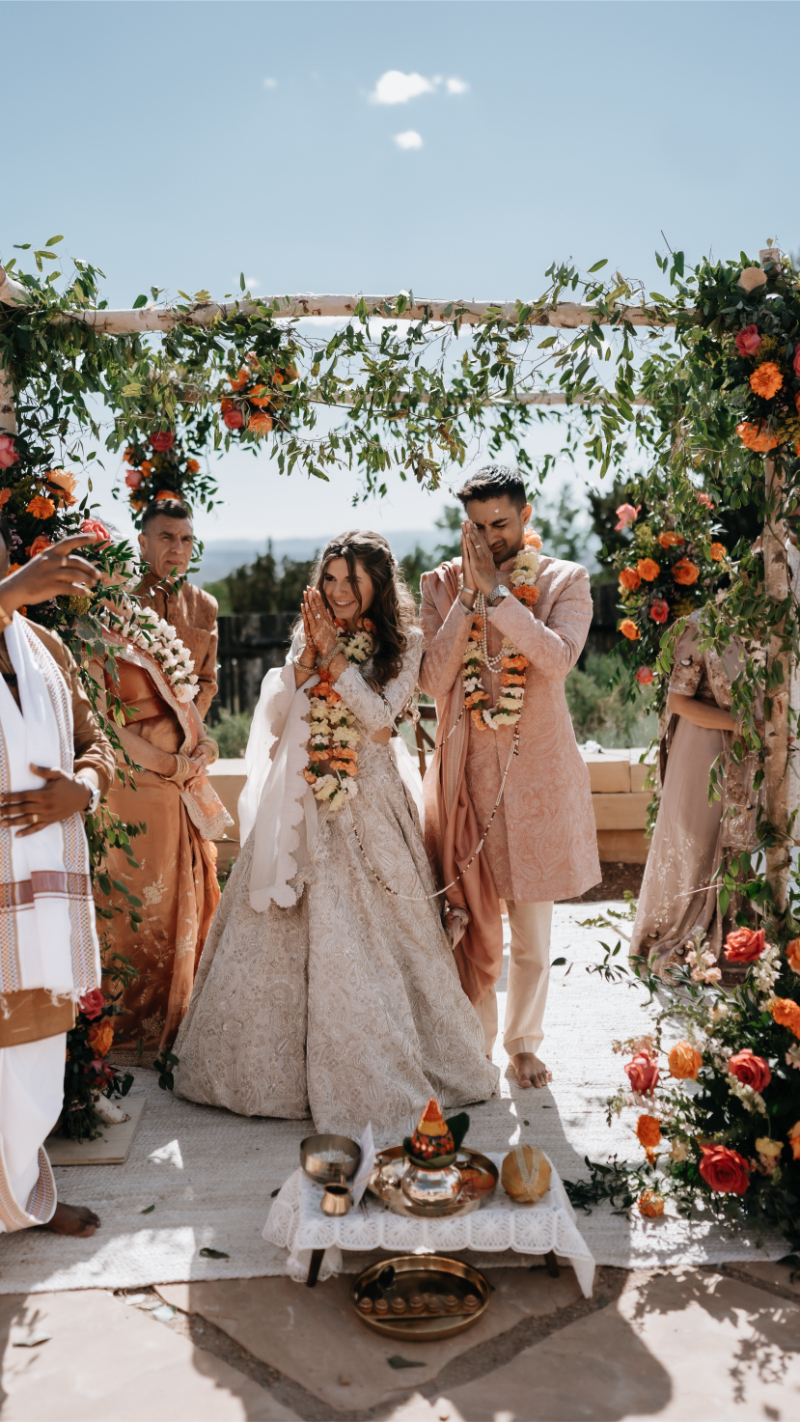 Bride and groom bowing to their guests as they exit their ceremony atop Jasper Highlands, Tennessee community.