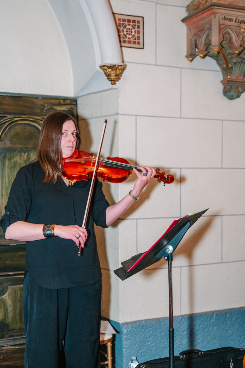Violist plays ceremony processional.